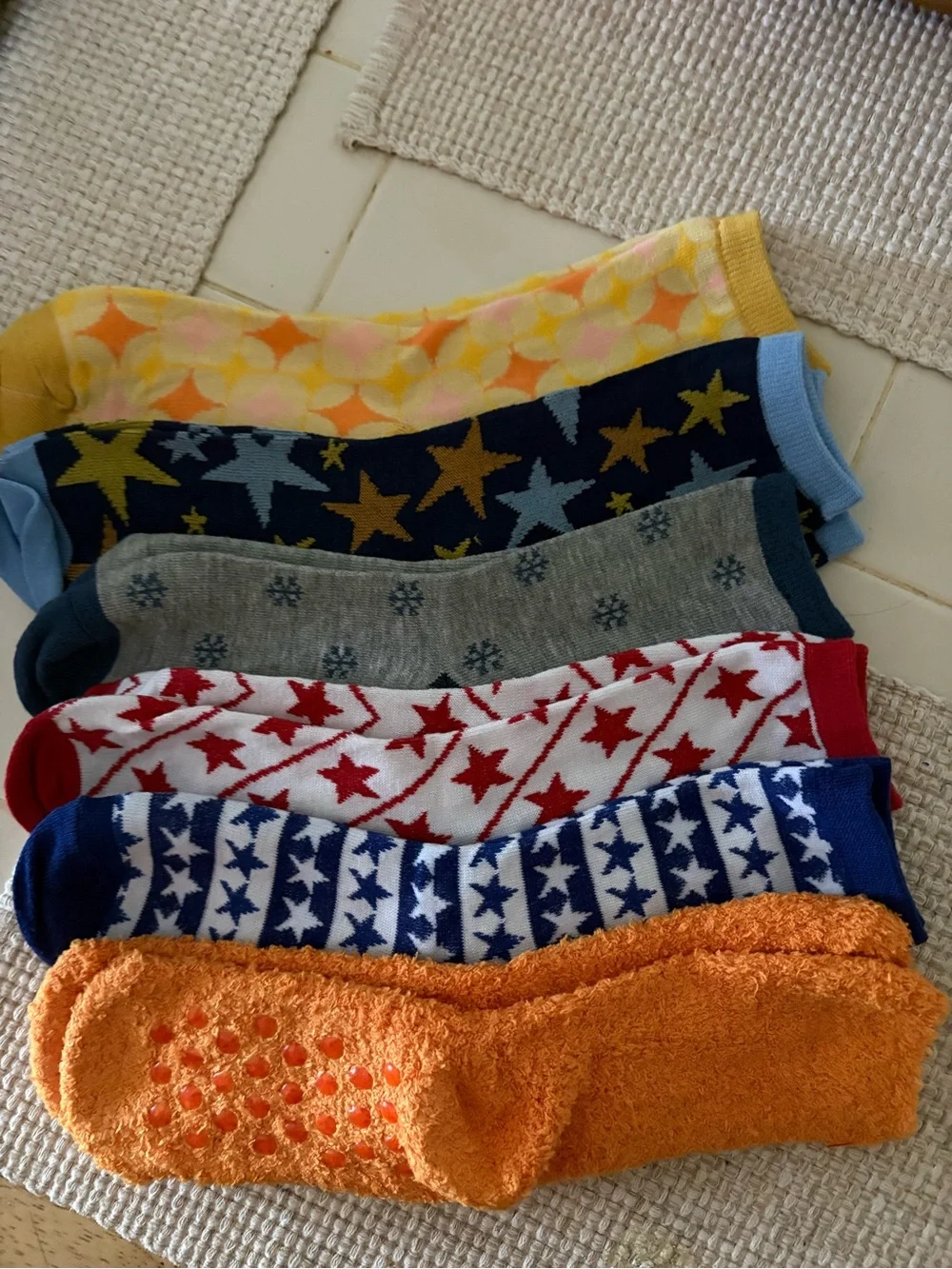 6 pairs of multi colored women’s socks.